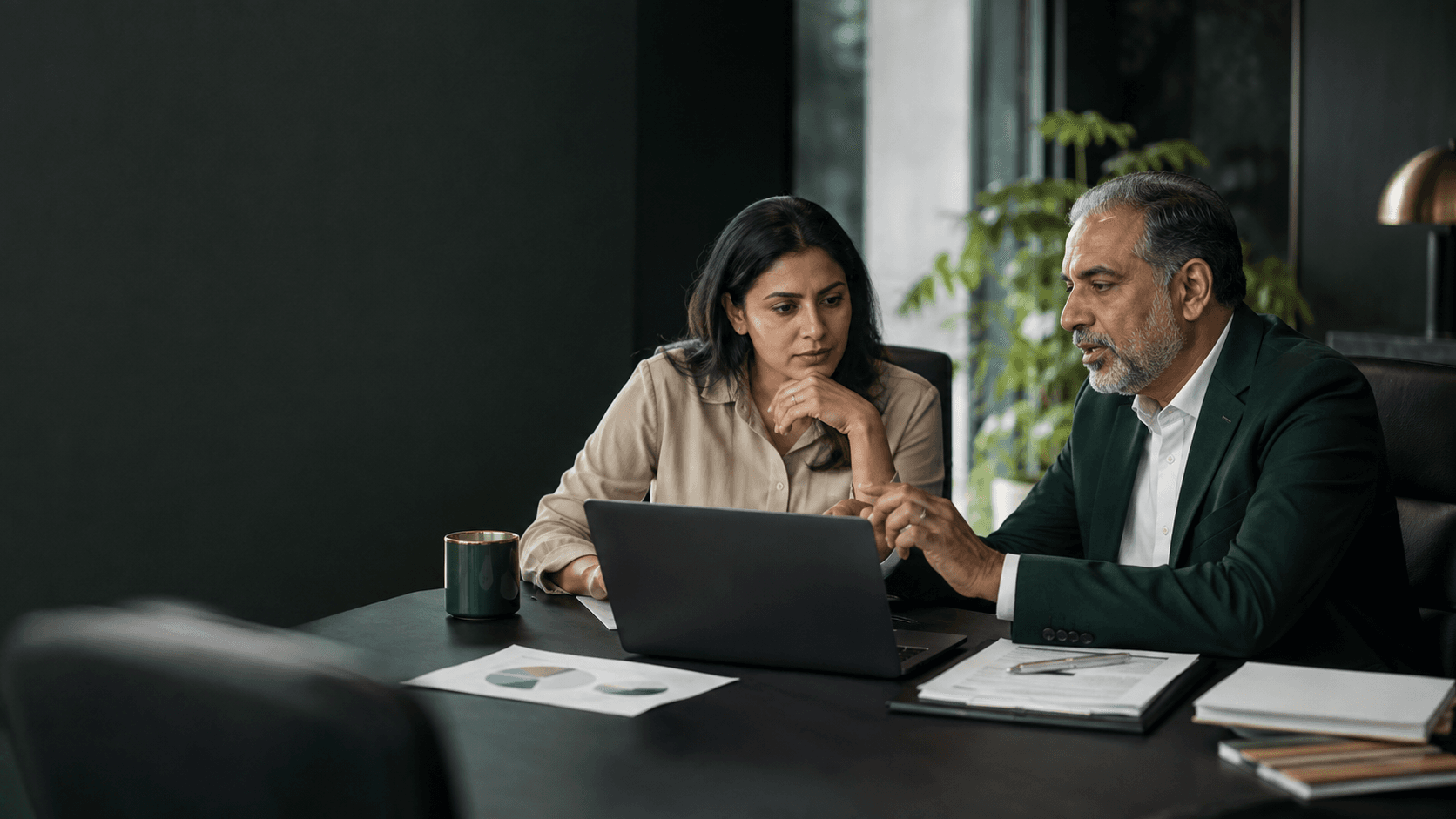 Illustrative scene of an entrepreneur working through a business decision with an experienced advisor